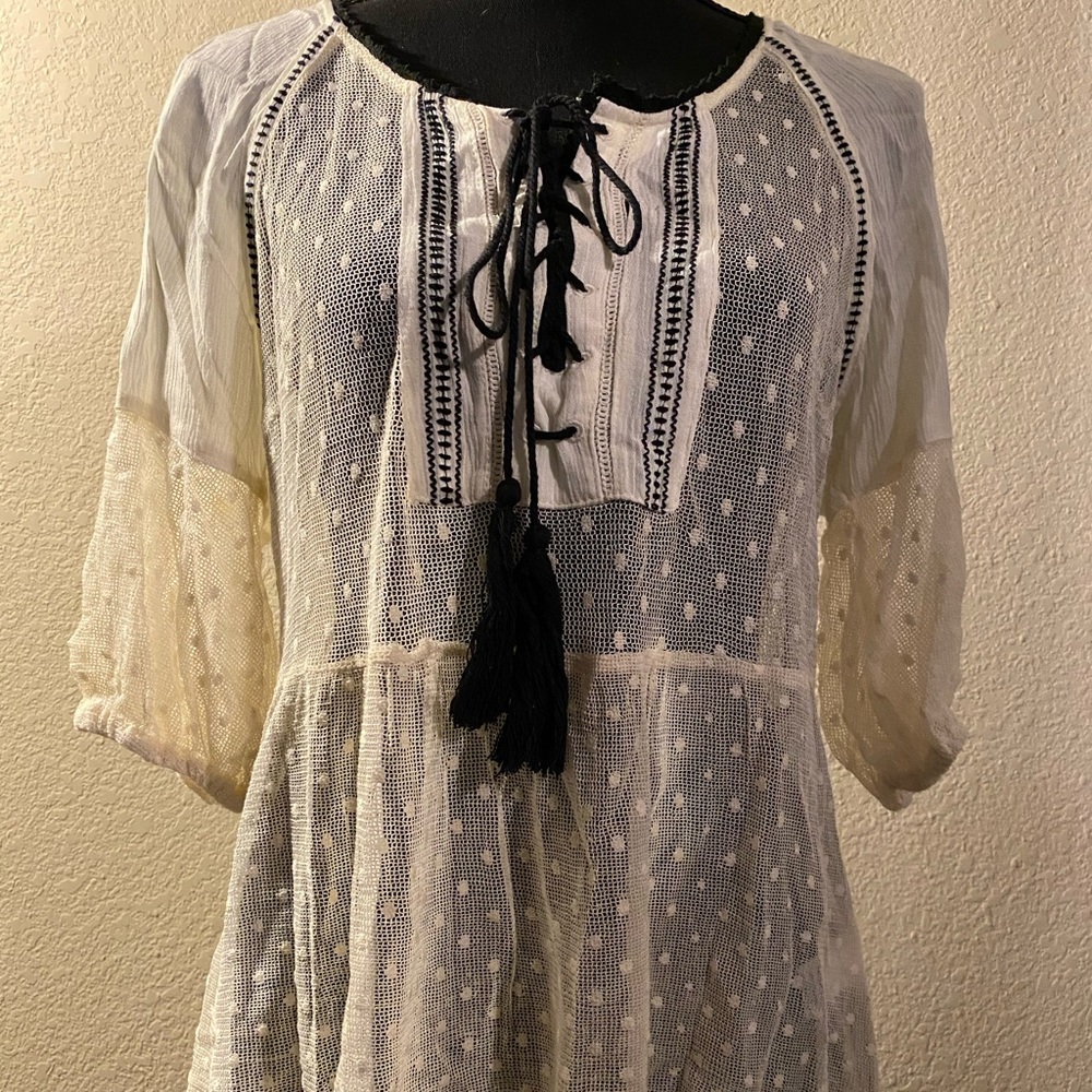 En Creme sheer cream and black top